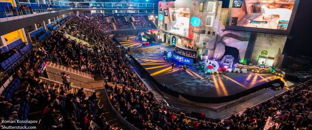 MOSCOW RUSSIA OCTOBER 2018 Counter Strike Global Offensive esports event. Main stage venue and tribunes full of visitors and fans. View from the top BANNER